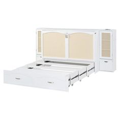 a white bed with two drawers underneath it