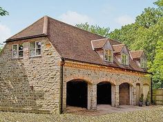 an old brick building with two garages