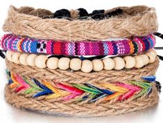 This handmade  hemp multiplayer bracelet sends off seriously hippie vibes with its rustic hand woven textures and smooth natural wooden beads. With a rainbow detail, this cheery accessory is a beautiful colorful piece. Embroidery Floss Bracelets, Collar Hippie, White Beads Bracelet, Layered Weave, Boho Embroidery, Boho Styl, Embroidery Bracelets, Wood Bead Bracelet, Rope Weave