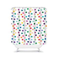 a shower curtain with multicolored polka dots on the outside, and white background