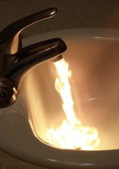 a sink that has fire coming out of it