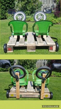 two green lawn mowers sitting on top of wooden pallets