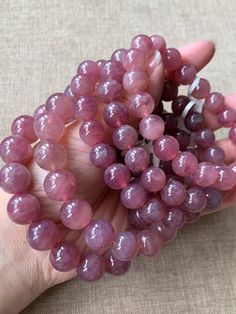 Material:Rose quartz beads size :10-13mm   quantity: one strand  6mm approx 29 pcs one strands 7mm approx25 pcs one strands 8mm approx 22 pcs one strands 9mm approx 21pcs one strands 10mm approx 19 pcs one strands 11mm approx 18pcs one strands 12mm approx 16 pcs one strands 13mm approx 16 pcs one strands 14mm approx 15 pcs one strands 15mm approx 14pcs one strands 16mm approx 14 pcs one strands 17mm approx 13pcs one strands 18mm approx 13pcs one strands 19mm approx 12pcs one strands 20mm approx Pink Hand-strung Round Crystal Bracelet, Pink Hand-strung Crystal Bracelet, Pink Crystal Gemstone Bracelet, Pink Gemstone Crystal Bracelet, Pink Round Crystal Gemstone Bracelet, Pink Natural Stones Crystal Bracelet, Elegant Rose Quartz Crystal Bracelet With Round Beads, Pink Crystal Bracelet With Natural Round Beads, Pink Crystal Bracelet With Natural Stones