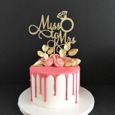 a white cake with pink and gold frosting on top that says sagery's fabulous birthday