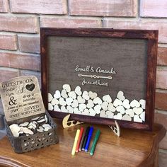 a small wooden box with candy sticks in it next to a sign that says congratulations