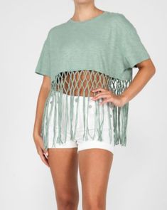 Featuring short sleeves and a pretty sage green, the Miss Me Women's Fringe Tee Shirt is the perfect addition to any cowgirl's wardrobe. Complete with fringe accents on the trim, its rib knit crew neck adds a touch of comfort to this stylish and fun-loving piece. Gentle machine was with like colors in cold water Tumble dry low Summer Short Sleeve Tops With Tassels, Casual Short Sleeve Tops With Tassels, Summer Tassel Short Sleeve Tops, Summer Fringe Tops With Short Sleeves, Summer Fringe Short Sleeve Top, Summer Short Sleeve Fringe Top, Trendy Fringe Short Sleeve T-shirt, Trendy Short Sleeve T-shirt With Fringe, Casual Summer Fringe T-shirt