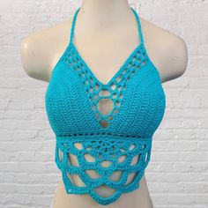 Made with soft cotton yarn in bright aqua with a mandala bodice.  >Ties in the back and around the neck, making it adjustable to fit different sizes. If you need a size that isn't listed please let me know, I can accomodate most sizes!  >>These tops are so soft and comfortable to wear!  Shown in Bright Aqua.  Want padding added? Add this listing to your order and choose from either push up or regular foam padding https://www.etsy.com/listing/399021473/add-padding-to-your-crochet-top Crochet Mandala Top, Mandala Top, Music Festival Fashion, Crochet Bralette, Womens Halter Tops, Crochet Clothing And Accessories, Crochet Mandala, Festival Tops, Crochet Top Pattern