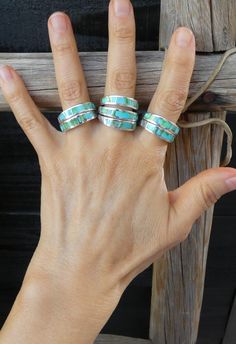 This sleek, gorgeous ring is handcrafted with Sterling Silver and features Sonoran Gold Turquoise inlaid stones. The sleek and smooth Navajo inlay design is a creative element that gives the piece its own unique flair! This ring has all the same precision and delicacy that the Navajo silversmiths are known for.  Let me know your size at checkout Choose your size at checkout (Sizes 7, 7.5, 8.5, 9.5) Width: 1/4" 4 grams Stamped: Sterling Artist Stamped: AT  This ring can be sized up or down by two sizes for an additional $25 fee. Ring Sizings take approximately 2 weeks turnaround. Add the following listing ID to your cart (253475134610) and send a note with the size you need. Send a message if you have questions. Please use the following link to add to your shopping cart at the time of purch Gorgeous Ring, Turquoise Ring Silver, Matching Bracelet, Matching Bracelets, Native American Jewelry, Band Ring, Turquoise Ring, Band Rings, Favorite Jewelry