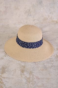 This summer accessory is fashion made easy, bringing a Parisian touch to a classic sunhat design with a polka dotted ribbon in navy and white. Perfect for your next outdoor event or beachside holiday, this sunhat with a subtle gold metallic weave, is crafted from polypropylene braid and straw in a neutral shade that will easily pair with your everyday looks. Outdoor Event, Ribbon Trim, Wearing Clothes, Summer Accessories, Sustainable Clothing, Velcro Straps, Winter Wear, Travel Style, Sun Hats