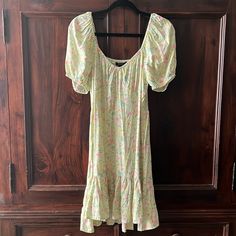 Forever 21 - Delicate Floral Dress L Beautiful Floral Pattern Against A Pale Green. Nwot, Smocked Back, Can Be Worn With The Shoulders Down Or Up. Gathered Shoulders And Small Tiers At The Bottom. Size Is L But Fits Like A M. Style With Cowboy Boots, Cowboy Hat And Denim Jacket For That Flirty Country Look. Feel Free To Make Me A Reasonable Offer. Forever 21 Green Spring Dress, Forever 21 Pink Vacation Dress, Forever 21 Floral Print Dress With Short Sleeves, Forever 21 Floral Print Short Sleeve Dress, Forever 21 Short Sleeve Spring Dress, Forever 21 Short Sleeve Dress For Brunch, Casual Green Forever 21 Dress, Spring Fitted Midi Dress From Forever 21, Spring Fitted Midi Dress By Forever 21