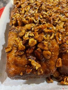 a close up of food on a tray with some pecans in the middle and other nuts around it