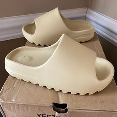 Yeezy Slide 8.5 womens tan color Yeezies Shoes, Yeezys For Women, Women’s Slides, How To Style Yeezy Slides, Tan Yeezy Slides Outfit Women, Yeezy Outfit Women Slides, Shoe Wishlist Women, Tan Yeezy Slides, Yeezy Slides Outfit Women