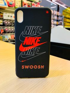 the nike phone case is on display in a store