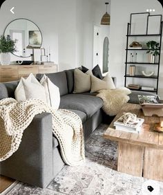 a living room filled with furniture and pillows