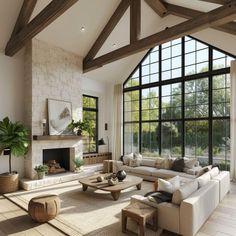 a living room filled with lots of furniture next to a fire place and large windows