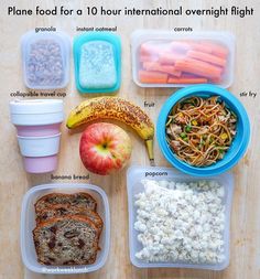 an assortment of food in plastic containers on a wooden table with information about the contents