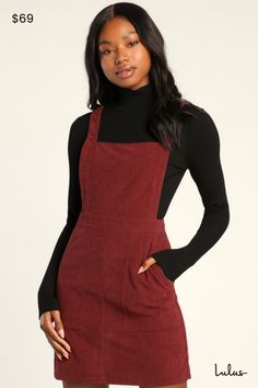 The Lulus Embracing Autumn Burgundy Corduroy Pinafore Mini Dress is the overall winner for the cutest look this season! This trendy pinafore dress has a velvety corduroy composition that shapes an apron-style bodice, a square neckline, and wide straps. A banded waist tops a figure-skimming mini skirt with front porkchop pockets. Exposed silver back zipper. Layer with a mock neck top for a retro 'fit! Fit: This garment fits true to size. Length: Mid-thigh. Size medium measures 33.25" from shoulder to hem. Bust: Great for any cup size. Waist: Fitted - very fitted at natural waist. Hip: Loosely Fitted. Fabric: Fabric has no stretch. Unlined. 97% Polyester, 3% Spandex. Hand Wash Cold. Do Not Bleach. Line Dry. Iron Low Heat. Imported. Lulus | Embracing Autumn Burgundy Corduroy Pinafore Mini Dre Corduroy Jumper Dress, Corduroy Dress Outfit Fall, Fall Outfits Dress, Graduation Dress University, Skater Dress Outfit, Corduroy Pinafore, Corduroy Pinafore Dress, Corduroy Top, Thanksgiving Dress