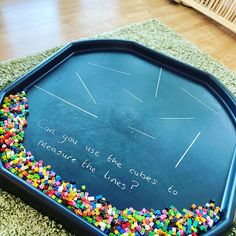 a chalkboard with colorful beads on it that says can you use the cubes measure the lines?