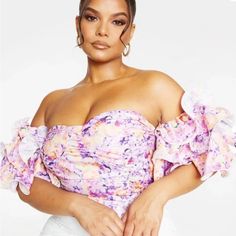 Brand New With Tag Floral Girly Off The Shoulder Top. The Ruffle Sleeves Are Very Romantic, It Zips Up The Back And Gives A Corset Vibe. Pretty Little Thing Size 20 Off-shoulder Floral Print Party Tops, Purple Ruffled Tops For Summer, Purple Summer Blouse For Brunch, Summer Purple Blouse For Brunch, Purple Summer Party Blouse, Off-shoulder Floral Print Party Blouse, Purple Summer Tops For Brunch, Fitted Lavender Summer Top, Summer Purple Blouse With Ruffles