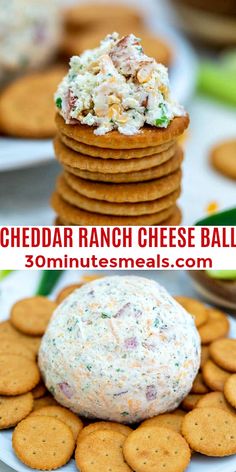 cheese ball on top of crackers with the words cheddar ranch cheese ball above it