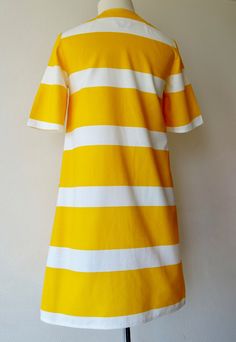 In this listing we are pleased to offer a wonderful vintage short summer dress or tunic by the Finnish clothing brand Fenno Sport. In fresh and stain free condition. Stunning dark yellow color, our absolute favorite. The color is deep dark yellow like a dark egg yolk. Really pretty and attractive. A color that stands out even from hundreds of meters away. Made from 100% cotton. The height of the horizontal yellow stripes is 10.3 centimeters / 4.05 inches height and the white 5.2 centimeters/ 2.0 Finnish Clothing, Short Summer Dress, Short Summer Dresses, Vintage Short, Dark Yellow, Textiles Fashion, Egg Yolk, Vintage Shorts, Yellow Stripes