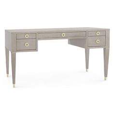 a grey desk with two drawers and gold handles on the top, against a white background