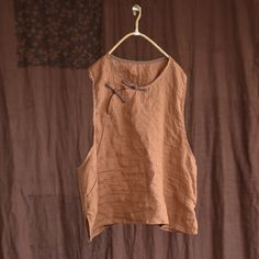 Details: Gender: Women Item Type: Vest Material: Linen Season: Summer Pattern: Solid Style: Casual, Loose, Retro Waist Type: Elastic Waist Size: One Size Length: 58.00 cm/ 22.83 " Bust: 128.00 cm/ 50.39 " Brown Cotton Top With Floral Embroidery, Brown Sleeveless Cotton Blouse, Sleeveless Brown Cotton Blouse, Traditional Brown Summer Tops, Brown Sleeveless Linen Top, Sleeveless Brown Linen Top, Linen Vest, Embroidered Hem, Summer Pattern