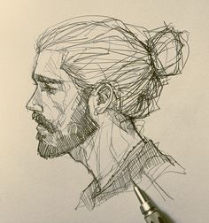 a pencil drawing of a man's head with a beard and mustache on paper