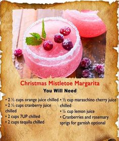 a recipe for christmas mistlet margaritas with raspberries on the rim and green leaves