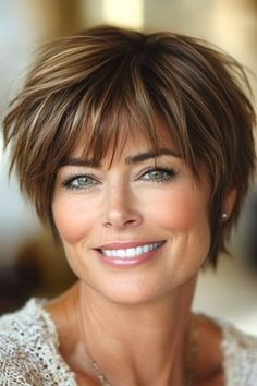 Save this pin for the best short layered haircuts with bangs. This shaggy pixie puts texture to work. The choppy layers are cut in varying lengths, creating a look that brings loads of volume and shape to a classic pixie cut. Short Length Haircut With Layers, Short Shaggy Haircuts With Bangs, Longer Pixie Haircut Fine, Shaggy Pixie Haircut, Short Layered Haircuts With Bangs, Long Pixie Cut With Bangs, Short Choppy Layered Hair, Pixie Cut With Long Bangs, Short Stacked Haircuts