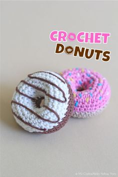 two crocheted donuts with chocolate frosting and sprinkles on them