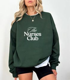 Green The Nurses Club Sweatshirt / Classy Nurse Gift / Sporty Chic Sweatshirt A sturdy and warm sweatshirt bound to keep you warm in the colder months. A pre-shrunk, classic fit sweater that's made with air-jet spun yarn for a soft feel. * 50% cotton, 50% polyester * Pre-shrunk * Classic fit * 1x1 athletic rib knit collar with spandex * Air-jet spun yarn with a soft feel * Double-needle stitched collar, shoulders, armholes, cuffs, and hem This product is made especially for you as soon as you pl Nyc Shirt, New York Sweatshirt, California Sweatshirt, Nyc Marathon, Chic Sweatshirt, Racing Club, California Shirt, Running On The Beach, Running Club