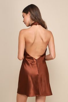 The Lulus Beyond Classy Brown Satin Halter Mini Dress is perfect for a night of bubbly and dancing! Sleek woven satin shapes this chic dress that has a halter neckline (with button closures) and a crisscrossing bodice. The column silhouette continues down to a mini hem with a thigh-high slit at the front. Hidden back zipper/clasp. Fit: This garment fits true to size. Length: Mid-thigh. Size medium measures 23.5" from top to bottom. Bust: Great for any cup size. Waist: Loosely Fitted. Hip: Loosel Brown Homecoming Dresses, Brown Short Dress, Brown Halter Dress, Short Brown Dress, Short Satin Dress, Casual Wedding Guest Dresses, Satin Halter Dress, Brown Mini Dress, Womens Trendy Dresses