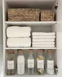 towels, soaps and other items are stored on shelves in the bathroom closet for storage