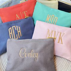 These monogrammed cosmetic bags are the perfect size to keep your essentials handy in your tote, backpack, purse, diaper bag or gym bag. The sturdy cotton canvas is available in eight different colors so you can select your favorite - or get several! These monogrammed bags make a great gift for bridesmaids, girlfriends and graduates! Personalized with an embroidery monogram to make it extra special! Product details: • 6" x 9" • Cotton Canvas with gold tone zipper closure • Spot Clean • Personali Monogramming Ideas, Monogrammed Makeup Bags, Monogram Cosmetic Bag, Personalized Makeup Bag, Hot Pink Bag, Couples Monogram, Gift For Bridesmaids, Personalized Makeup Bags, Cosmetic Bag Set