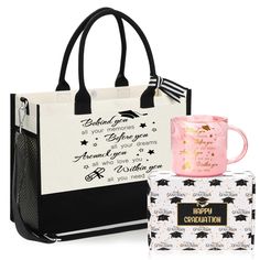 a black and white bag with a pink mug next to it