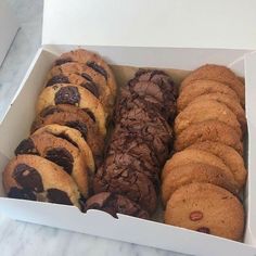 a box filled with cookies and chocolate chip cookies