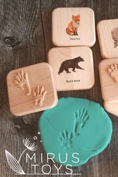 four wooden coasters with hand prints on them and the words, mrus toys