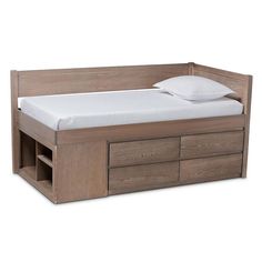 a bed with two drawers underneath it and a pillow on the top of one drawer