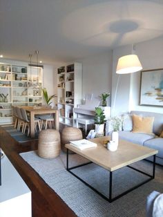 a living room filled with furniture next to a fire place