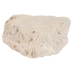 a white rock is shown against a white background