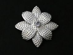 Vintage, Pretty silver, layered textured flower brooch with central prong set clear sparkly rhinestone. Nice design and detail. Clasp:    C clasp and pin in tact. Signed:  Signed Silver on the back, also tests for silver with acid. SIZE: Approx: 4.7 cm x 4.7 cm  Weight approx: 8 grams Condition: Very good. Silver Flower-shaped Brooches With Rhinestones, Rhinestone Flower, Nice Design, Flower Brooch, Clear Rhinestones, Prong Setting, Brooch Pin, Brooches, Cool Designs