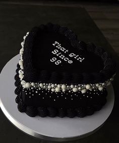 a heart shaped cake with pearls on the edges and lettering that says happy birthday 99