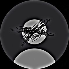 an abstract black and white photo with the moon in the background, as seen through a circular object