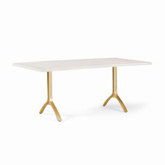 a white table with gold legs and a marble top, against a white background the table is shaped like a cross