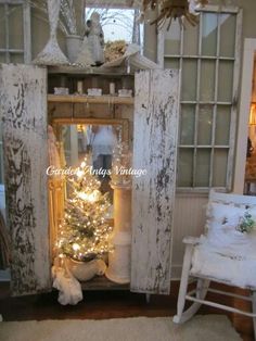 an old door is decorated with christmas decorations and lights for the holiday tree in this room