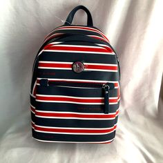 Hilfiger Striped Backpack Purse 14” Height 9” Length 6” Width Adjustable Shoulder Straps Colors Blue, Red, White Inside Organization Pockets Inside Zipper Pocket Front Zipper Pocket New Sf/Pf Home Casual Tommy Hilfiger Bags For Everyday, Casual Navy Backpack Bag, Preppy Blue Backpack Bag, Casual Red Backpack With Zipper Pocket, Casual Tommy Hilfiger Bag With Adjustable Strap, Tommy Hilfiger Red Bag For Everyday Use, Tommy Hilfiger Travel Backpack, Trendy Tommy Hilfiger Bags With Zipper Closure, Sporty Blue Backpack With Zipper Closure