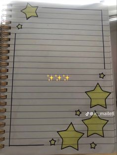 an open notebook with stars drawn on it