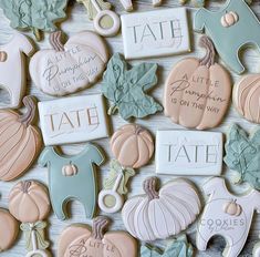 many decorated cookies are arranged on a table