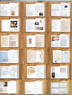 several open books are arranged on a wooden surface